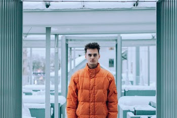 Man Wearing Orange  Bubble Jacket