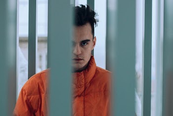 Man Wearing Orange Jacket