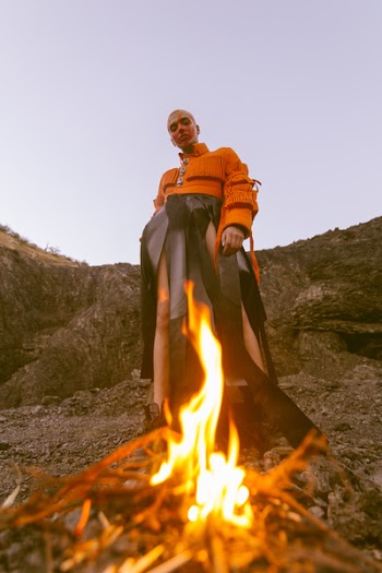 Man Wearing Orange Long-sleeved Shirt and Black Bottoms