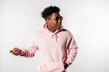 man wearing pink pullover hoodie