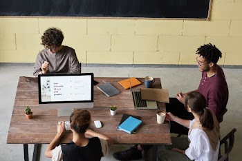 Man Wearing Purple Long-sleeved Shirt Using Silver Macbook Pro