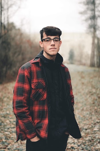 Man Wearing Red and Black Jacket and Black Hoodie