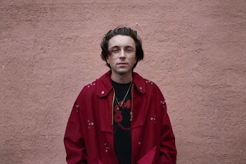 man wearing red coat