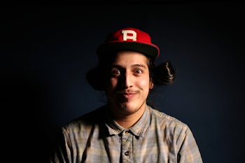 Man Wearing Red Fitted Cap and Brown and Gray Plaid Collared Hsirt
