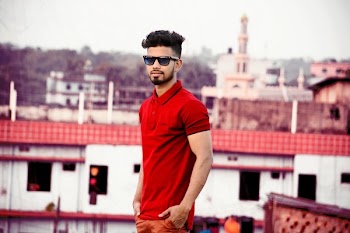 Man Wearing Red Polo Shirt With Hands on Pocket