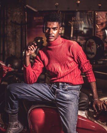 Man Wearing Red Turtleneck Sweater Sitting on Red Motorcycle
