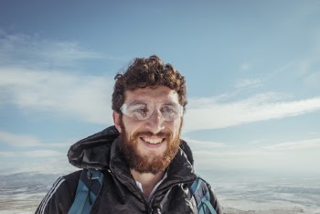Man Wearing Shield Eyeglasses and Jacket