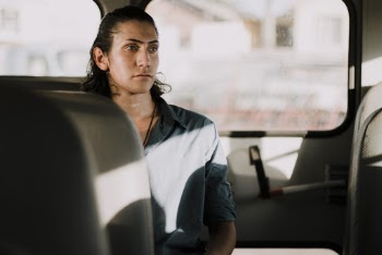 Man Wearing Shirt Sitting Inside Vehicle