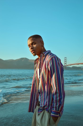 Man Wearing Striped Long Sleeved Shirt