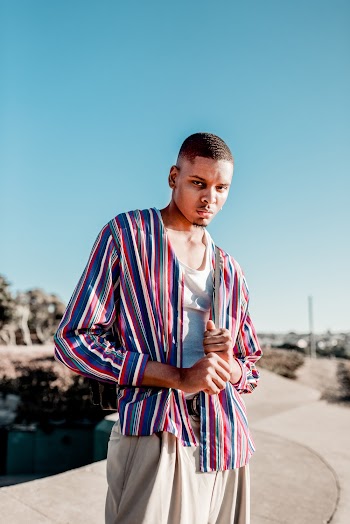 Man Wearing Stripped Long-sleeved Shirt