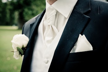Man Wearing Suit in Close-up Photography