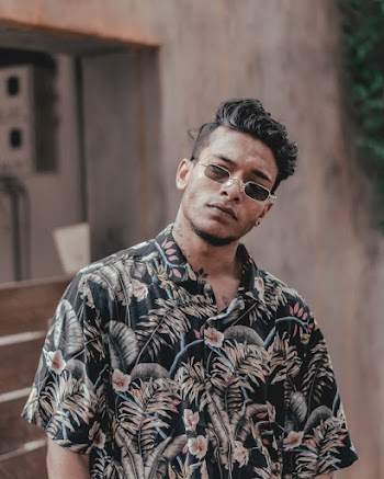 Man Wearing Sunglasses and Floral Short Sleeve Shirt