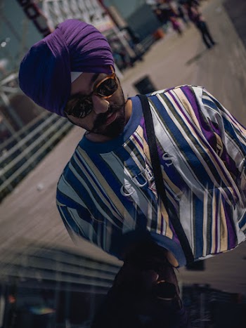 Man Wearing Sunglasses, Purple Turban, and Pinstriped Crew-neck Top