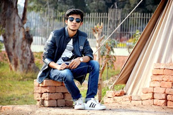 Man Wearing Sunglasses Sitting on the Concrete Bricks