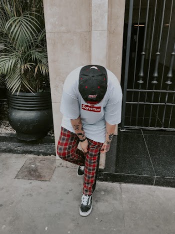 Man Wearing Supreme T-Shirt