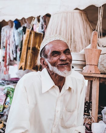 Man Wearing Taqiyah Cap at the Market