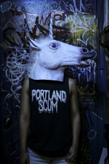 Man Wearing Unicorn Mask