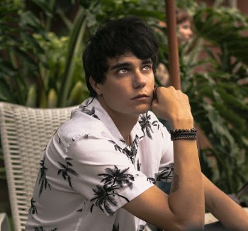 Man Wearing White and Black Collared Top Looking Up