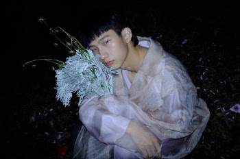 Man Wearing White and Purple Long-sleeved Dress
