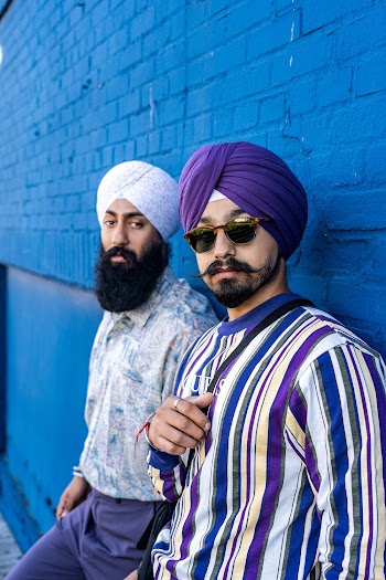 Man Wearing White and Purple Turbans