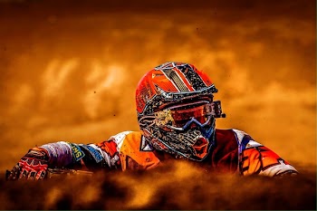 Man Wearing White Black and Orange Motorcross Suit