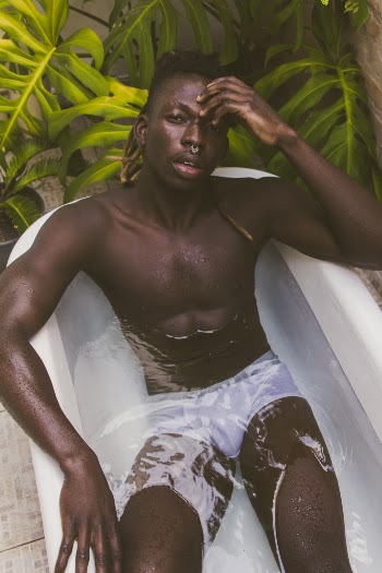 Man Wearing White Brief on Bathtub