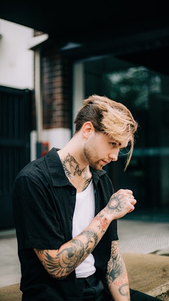 Man Wearing White Crew-neck Shirt and Black Polo Shirt