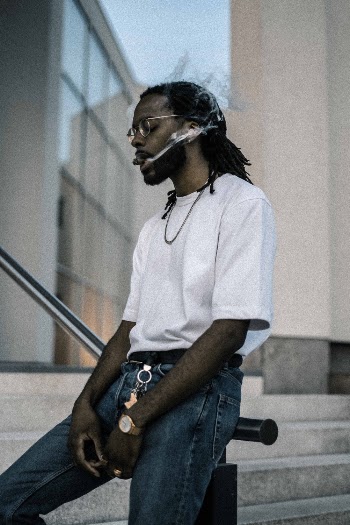 Man Wearing White Crew Neck Shirt And Blue Jeans