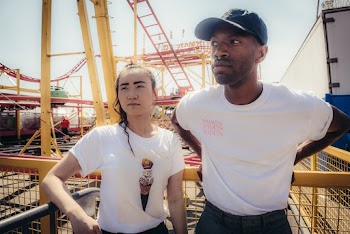 Man Wearing White Crew-neck Shirt Besides Woman Wearing White Crew-neck Shirt