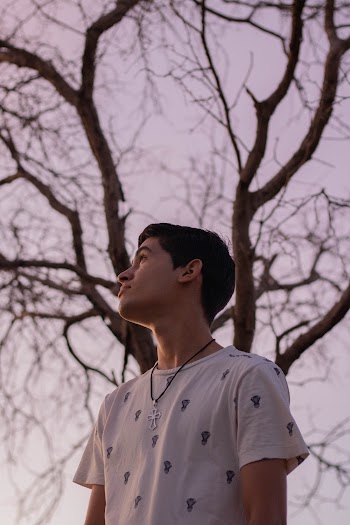 Man Wearing White Crew-neck Shirt Looking Upward