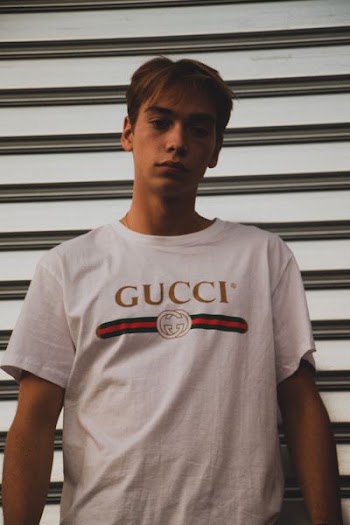 man wearing white Gucci shirt
