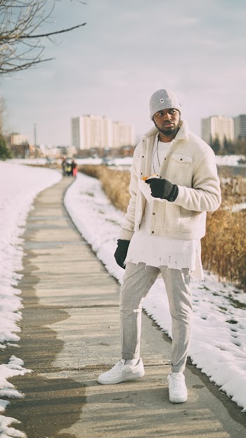 Man Wearing White Jacket Standing On Pathway