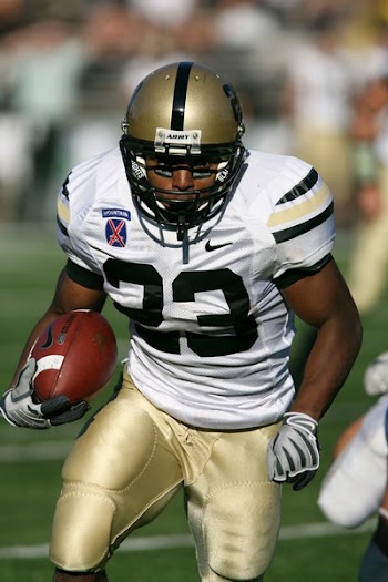 Man Wearing White Nike 23 Football Jersey on Green Field