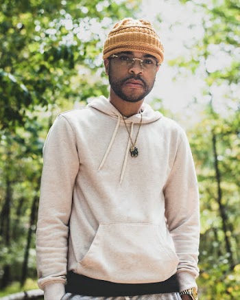 Man Wearing White Pullover Hoodie and Beanie Hat