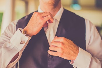 Man Wearing White Shirt and Black Vest
