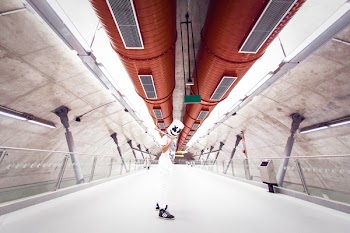 Man Wearing White Shirt and Pants on Tunnel