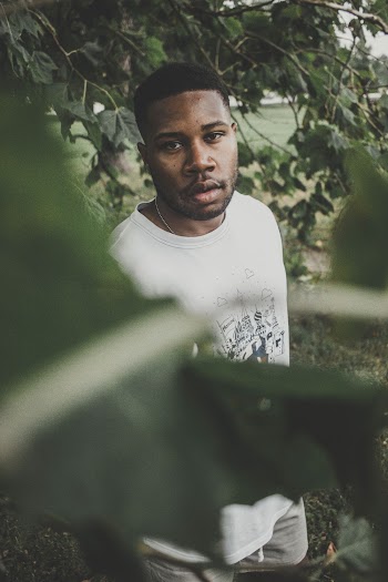 Man Wearing White Shirt Standing Beside Tree