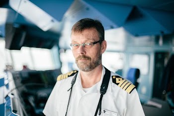 man wearing white uniform selective focus