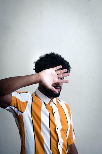Man Wearing Yellow and White Striped Shirt