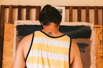 Man Wearing Yellow and White Tank Top