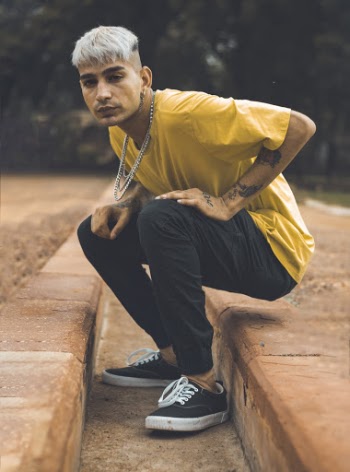 Man Wearing Yellow Shirt and Black Pants