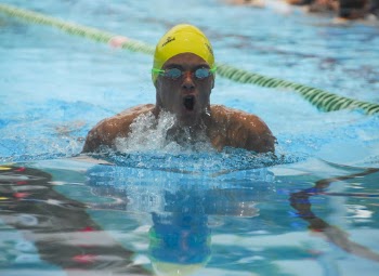 Man Wearing Yellow Swimming Cap About to Swim