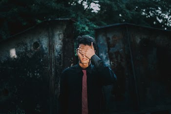 Man Wears Black Suit With Red Necktie