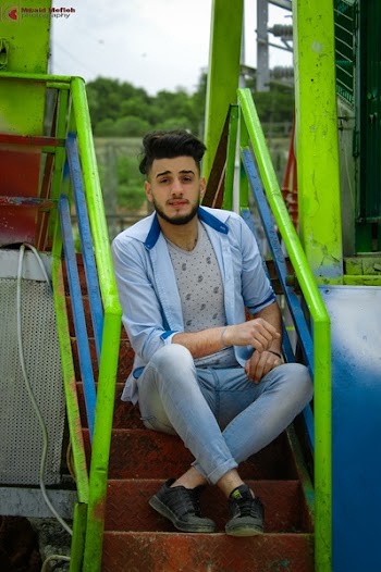 Man Wears Blue Dress Shirt Sitting on the Stair
