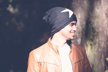 Man With Black Cap Smiling