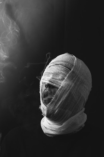 Man With Face Covered With Bandage