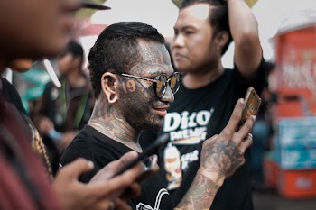 Man With Gray Wash in Full Face Tattoo