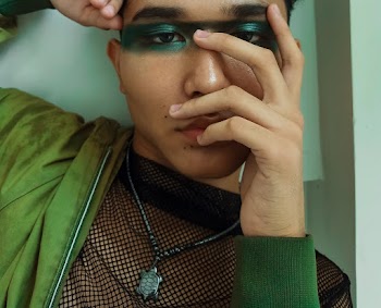 Man with Green Eye Makeup