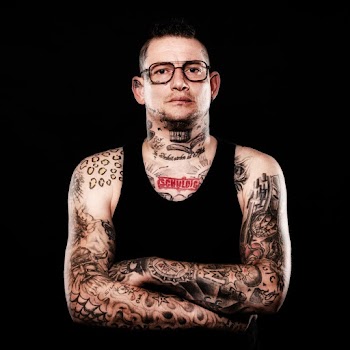 Man With Tattoo Wearing Black Tank Top