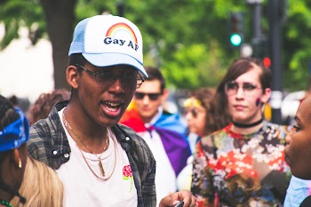 Man With White Crew-neck Shirt Beside Woman With Multicolored Shirt at Daytime